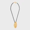 Celine Dafila Shell Necklace in Brass with Gold Finish and Silk Celine Dafila Shell Necklace in Brass with Gold Finish and Silk