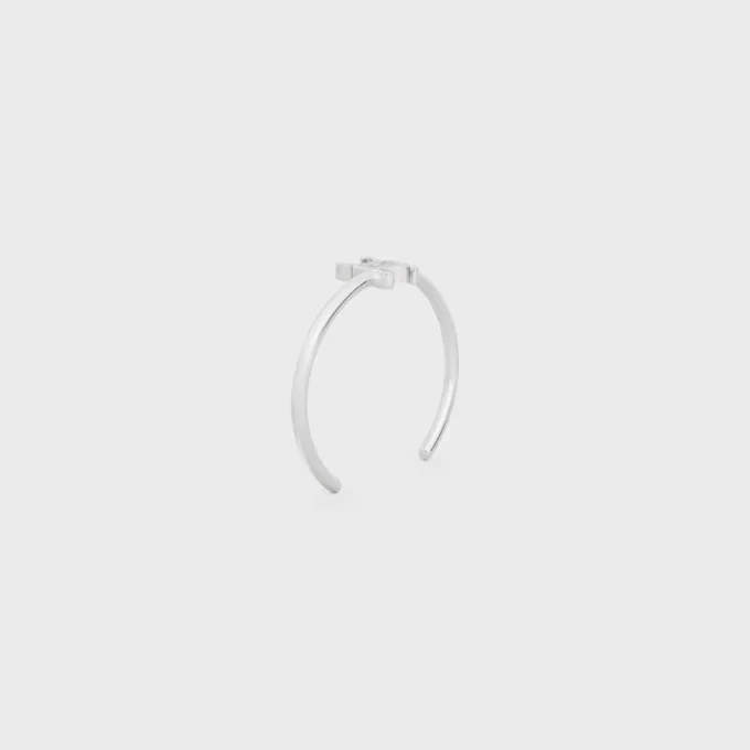 Triomphe Asymmetric Cuff in Brass with Rhodium Finish Triomphe Asymmetric Cuff in Brass with Rhodium Finish